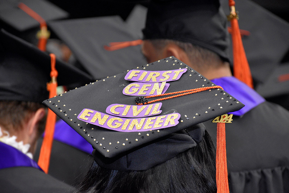 Close-up of a graduation cap decorated that reads first gen civil engineer