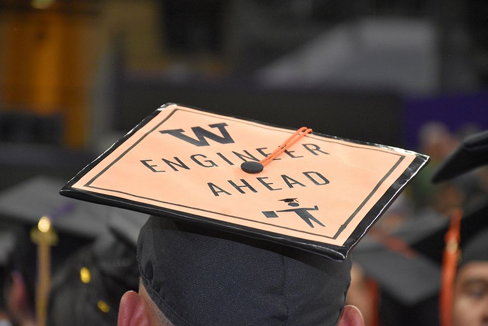 Close-up of a graduation cap that reads W engineer ahead