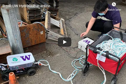 A video still frame that shows a student testing a rover