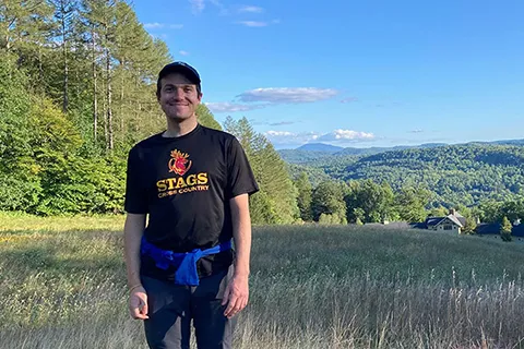 Dan McCabe standing in a grassy field