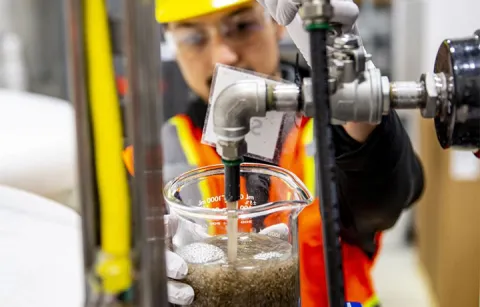 Granular sludge running out of a spigot 