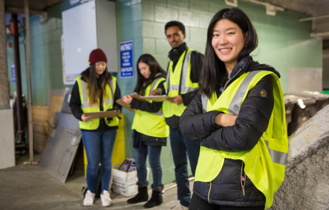 Students in bright chartreuse safety vests