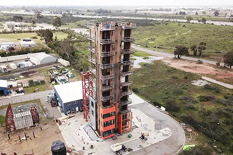 The exterior of a 10-story building constructed from mass timber