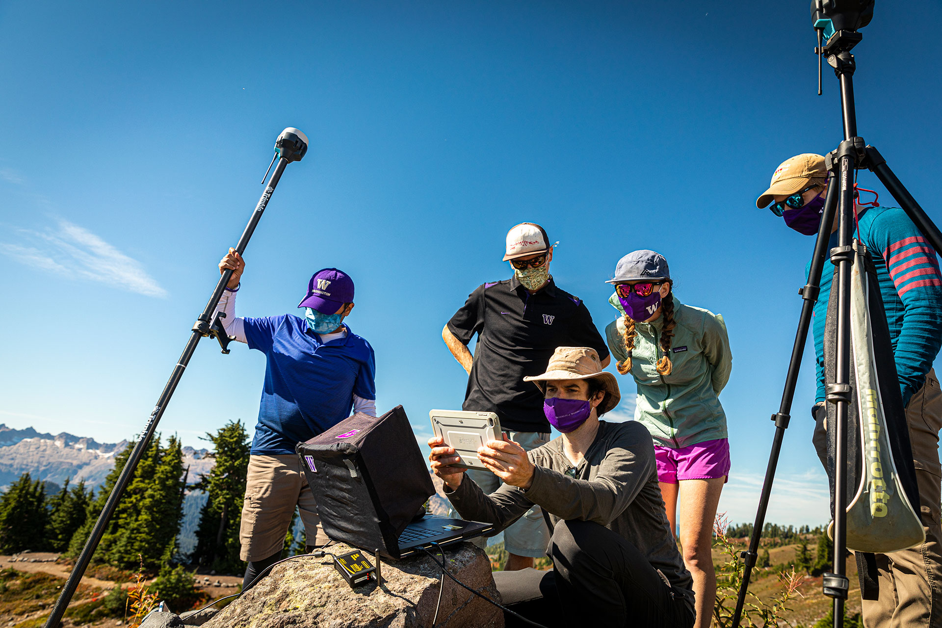 David Shean and four students looking at a surveying device together