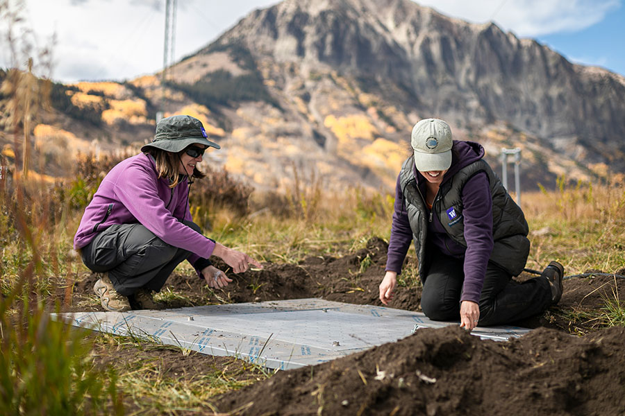 Professor Jessica Lundquist and alumna Julie Vano set up a snow pillow