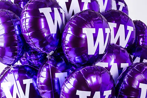 Purple balloons with a W on them.