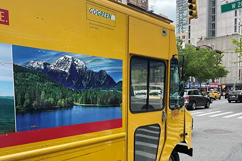 A bus driving on a city street.